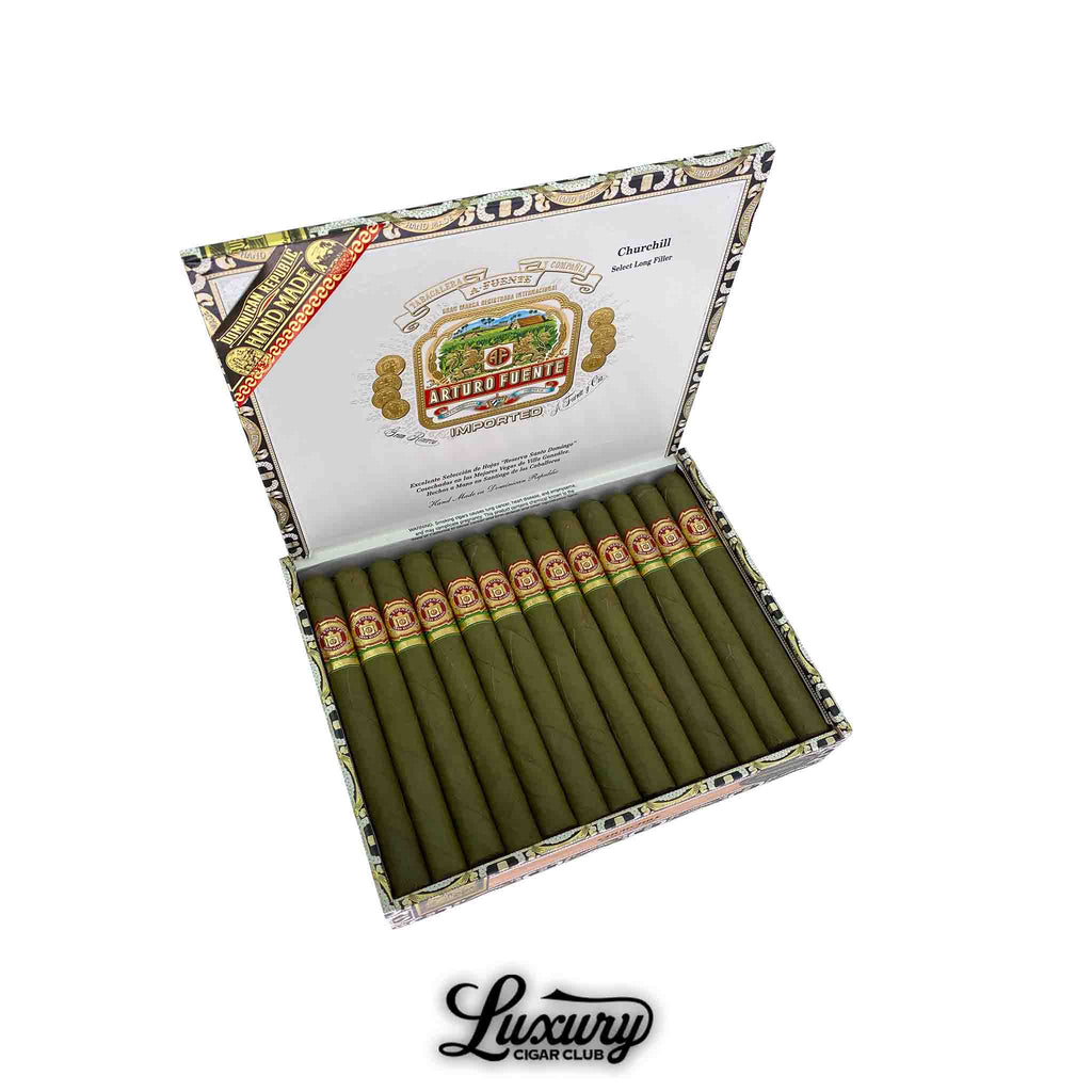 Box of Arturo Fuente Gran Reserva Churchill Claro cigars with green candela wrappers and classic red and gold bands, neatly arranged in an open branded box.