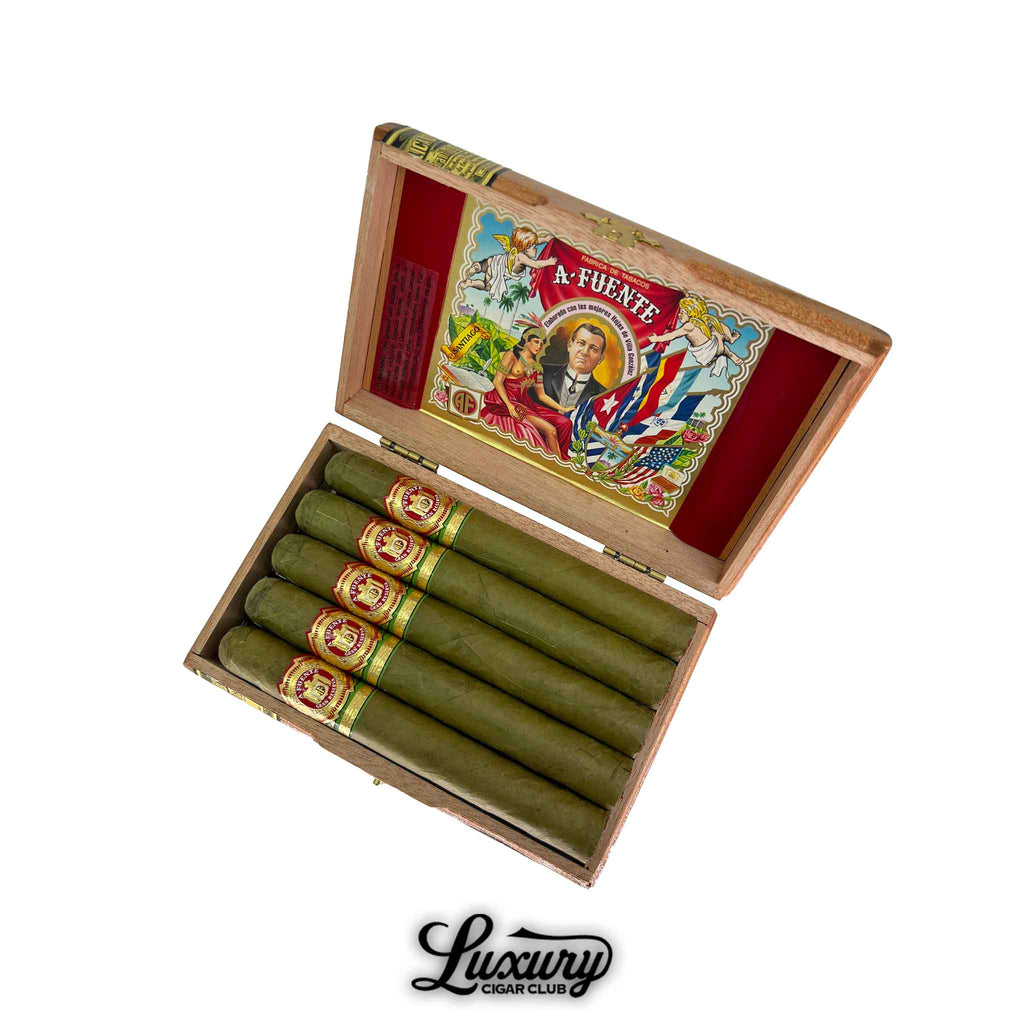 Open box of Arturo Fuente Gran Reserva Flor Fina 8-5-8 Claro cigars with green claro wrappers and iconic red and gold bands — Luxury Cigar Club premium selection.