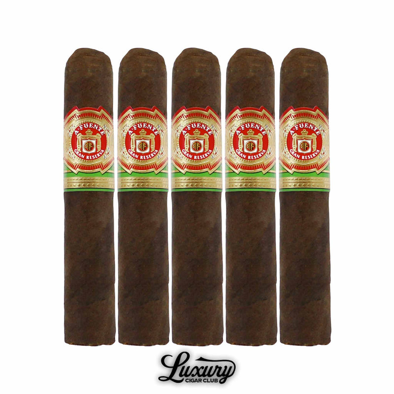Five Arturo Fuente Gran Reserva Rothschild Maduro cigars with dark wrappers and red and gold bands, from Luxury Cigar Club