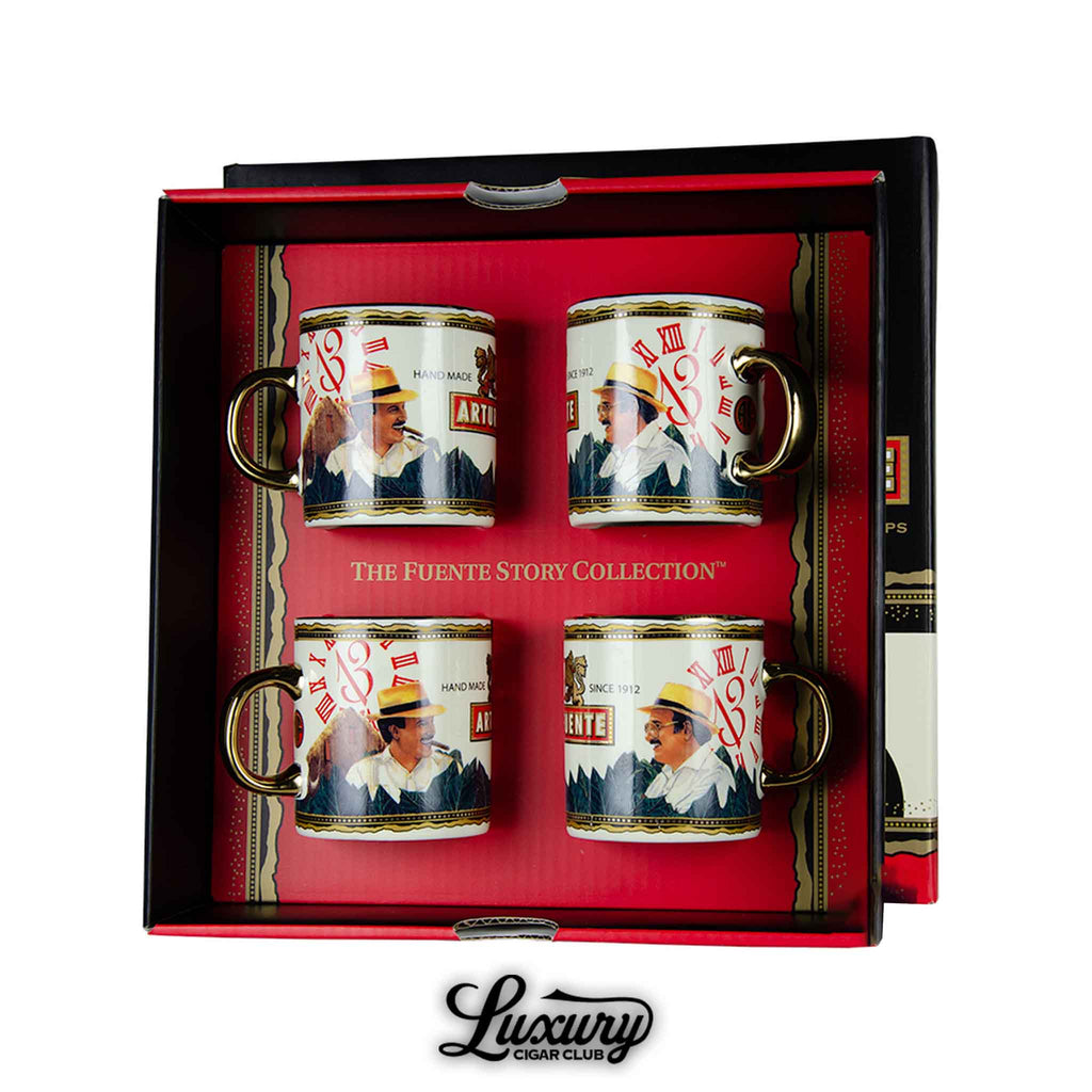 Luxury Cigar Club showcases the Arturo Fuente Hands of Time Limited Edition espresso cups set featuring four mugs with artistic cigar-themed designs in a presentation box.