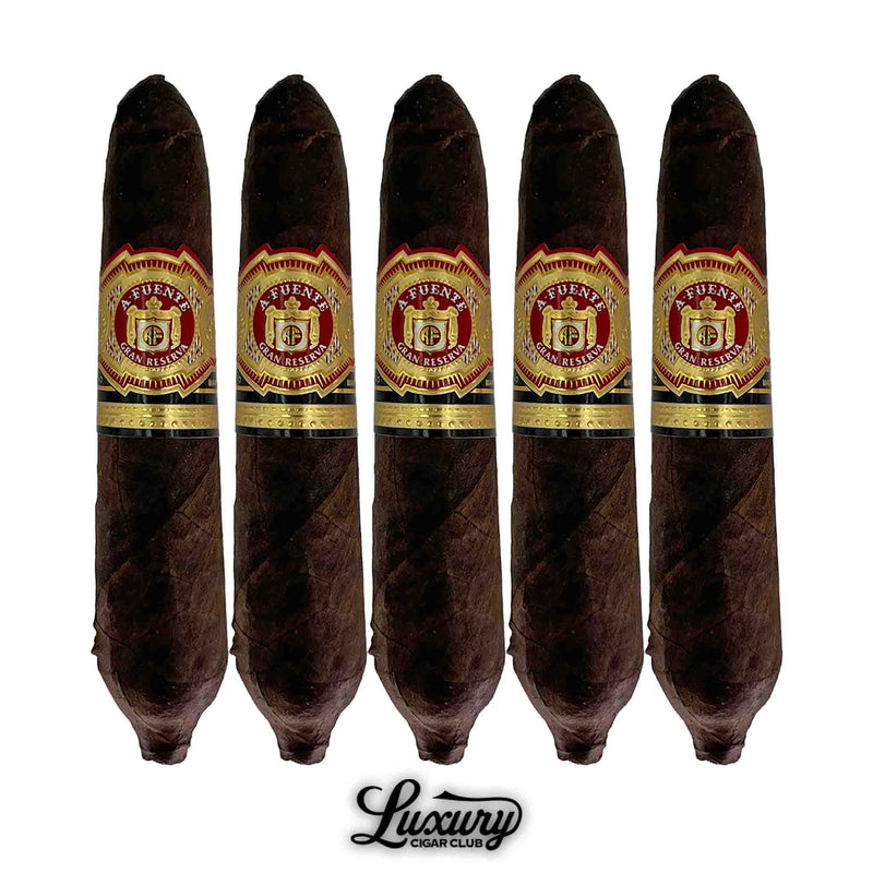 Five-pack of Arturo Fuente Hemingway Maduro Work of Art cigars with pointed figurado shape and red-and-gold bands, displayed with the Luxury Cigar Club logo.