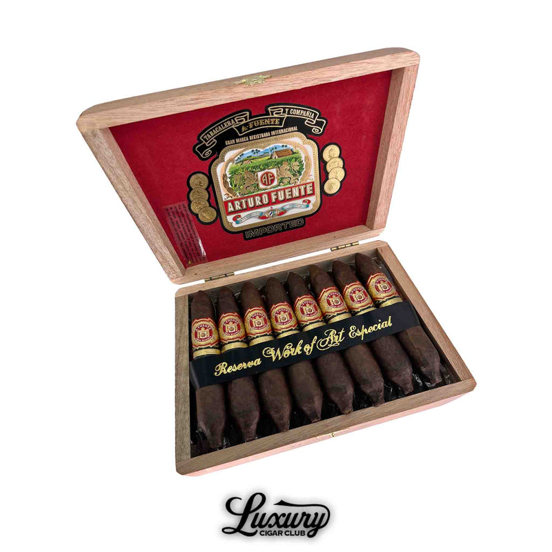 Open box of Arturo Fuente Hemingway Maduro Work of Art Especial cigars featuring ten expertly crafted figurado-shaped cigars with signature red and gold bands, displayed in a cedar-lined box with red velvet lid and classic Arturo Fuente branding — Luxury Cigar Club.