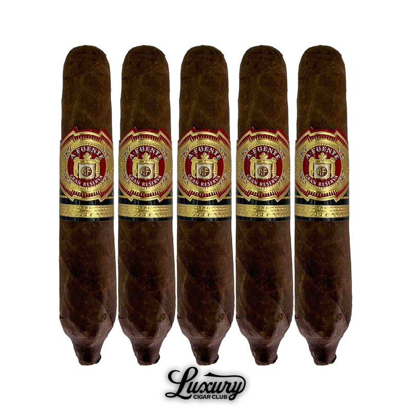 Five Arturo Fuente Hemingway Best Seller Natural cigars with dark brown wrappers and signature red-and-gold Fuente bands, displayed in a vertical row with Luxury Cigar Club logo.