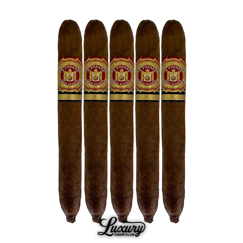 Pack of five Arturo Fuente Hemingway Natural Signature cigars with medium-brown wrappers and detailed Fuente family bands, arranged in a row.