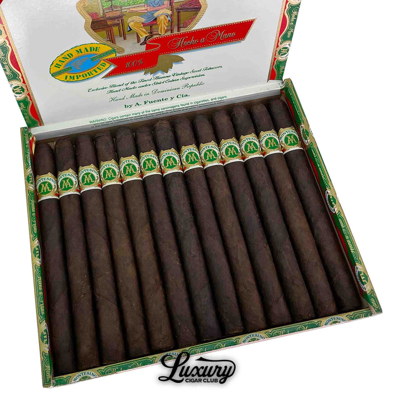 Close-up of an open box of Arturo Fuente Montesino Maduro Numero 1 cigars, featuring dark, aged Connecticut Broadleaf wrappers and green “M” bands, with Luxury Cigar Club branding beneath the box.
