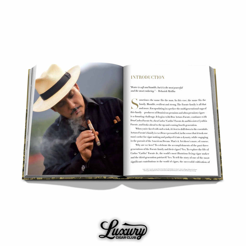 Inside page of the Arturo Fuente cigar book showing Carlito Fuente smoking a cigar and introductory text – premium publication from Assouline.