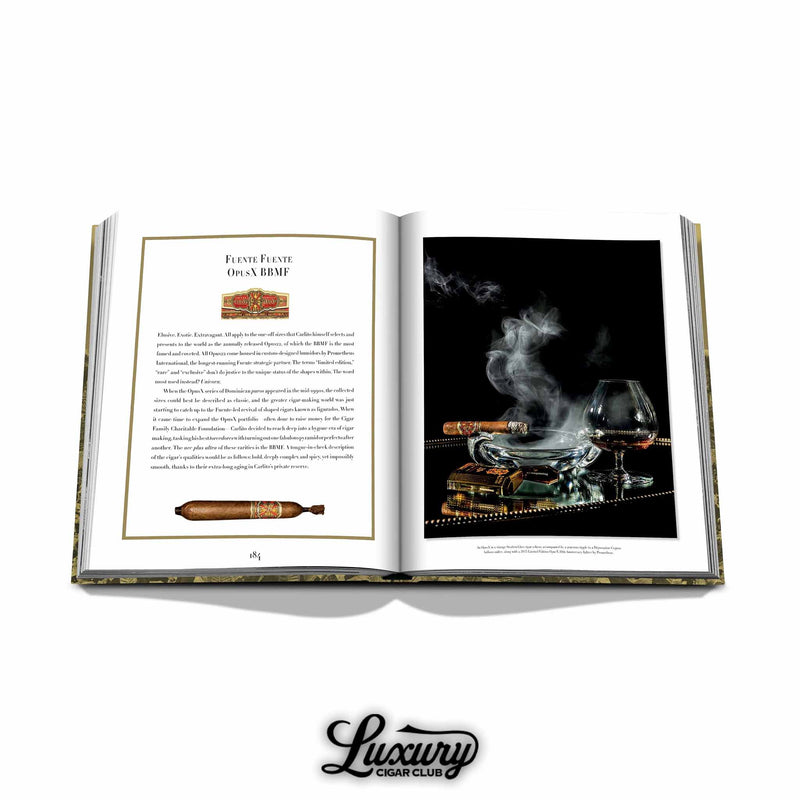 Opus X BBMF cigar featured in Arturo Fuente book next to a smoking cigar and snifter of cognac – luxurious cigar lifestyle imagery.
