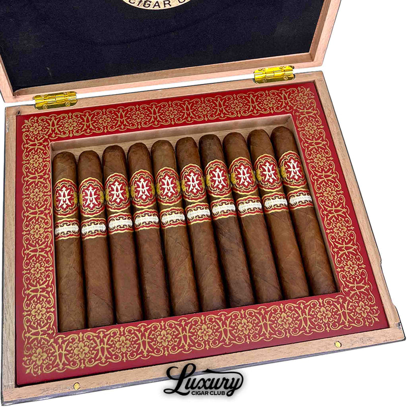 Close-up of Avowed Awakening Limited Edition 2024 Gran Robusto cigars in a box, highlighting the detailed red and gold band design.
