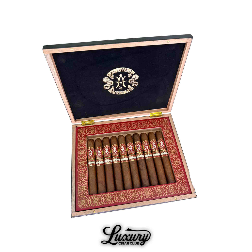 Open box of Avowed Awakening Limited Edition 2024 Gran Robusto cigars, showcasing premium brown wrappers with ornate red and gold cigar bands.