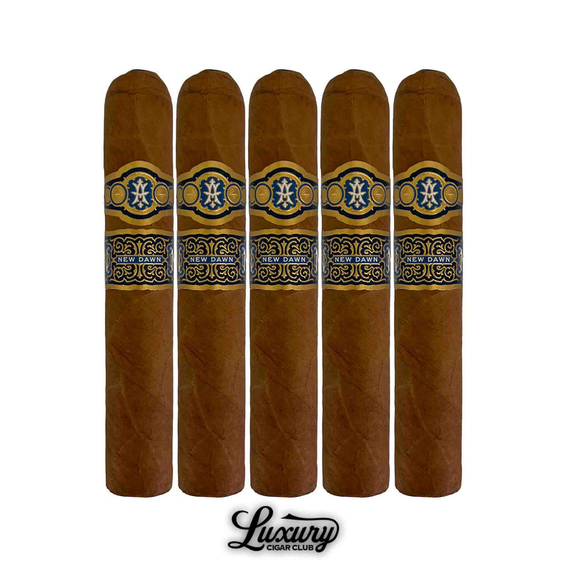 Five Avowed New Dawn Robusto Grande cigars aligned together, featuring golden-brown wrappers and ornate blue and gold bands, photographed at Luxury Cigar Club.