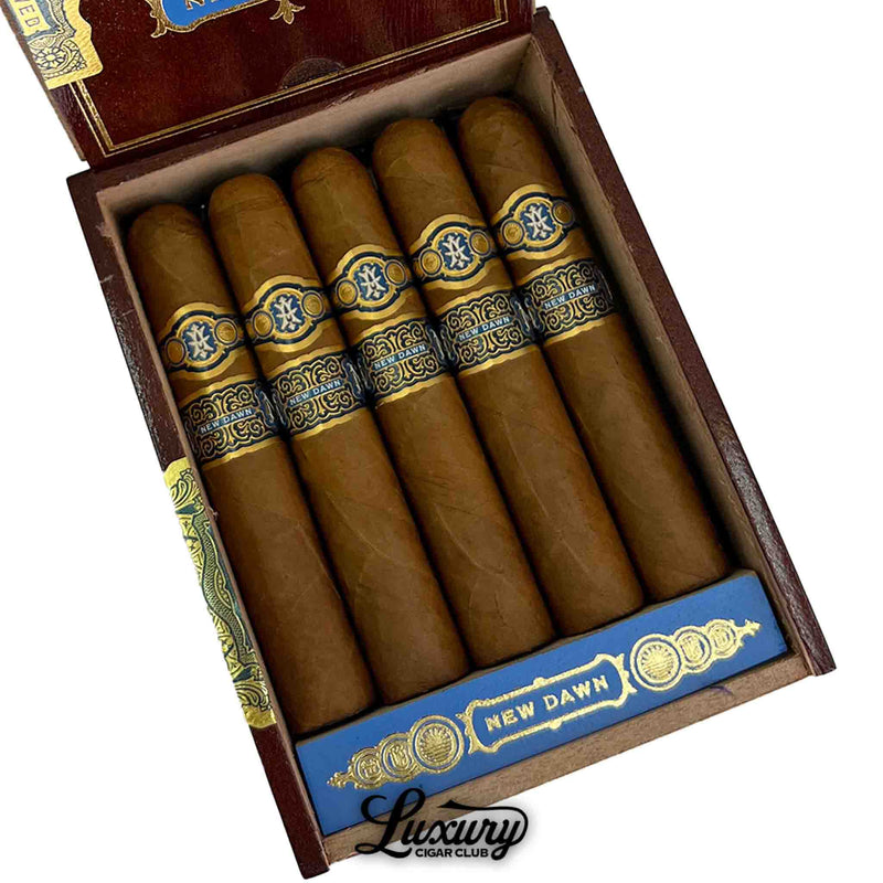 Five Avowed New Dawn Robusto Grande cigars aligned together, featuring golden-brown wrappers and ornate blue and gold bands, photographed at Luxury Cigar Club.