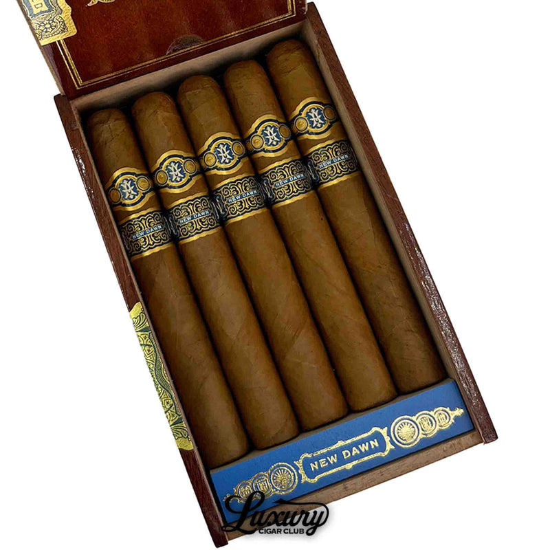 Close-up of Avowed New Dawn Toro cigars inside an open wooden box, highlighting the golden-brown wrappers and intricate blue and gold cigar bands at Luxury Cigar Club.