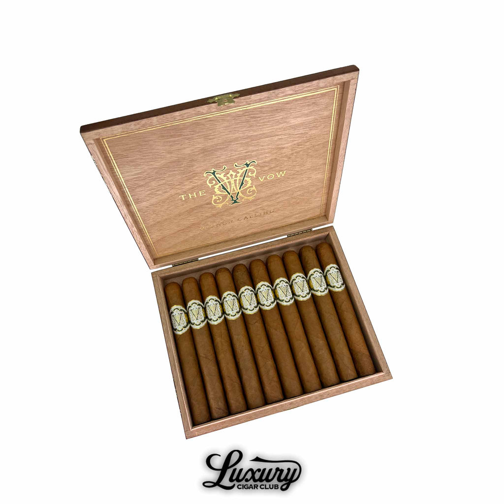 Open cedar box of Avowed The Vow Higher Calling Toro cigars, neatly arranged with golden embossed cigar bands, available at Luxury Cigar Club.