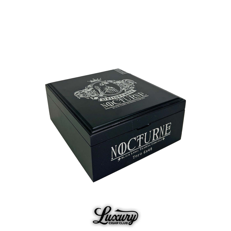 Closed matte black box of the Black Label Trading Co. Deliverance Nocturne Toro featuring the silver Nocturne crest and Deliverance branding on the lid and side, displayed by Luxury Cigar Club.