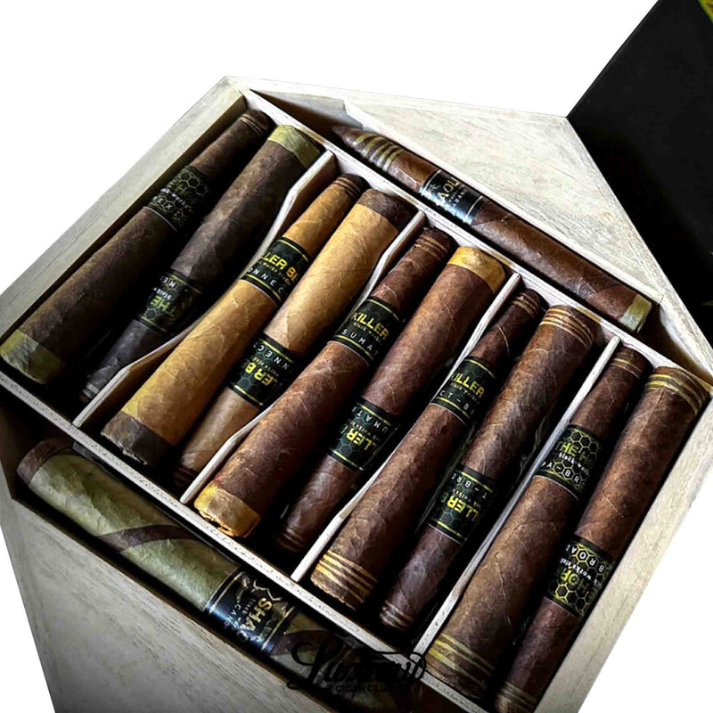 Close-up of The Five Temples Seven Star Fist of Shaolin 12-pack by Black Works Studio showing intricate cigar variety with bold black and gold labeling, presented by Luxury Cigar Club.