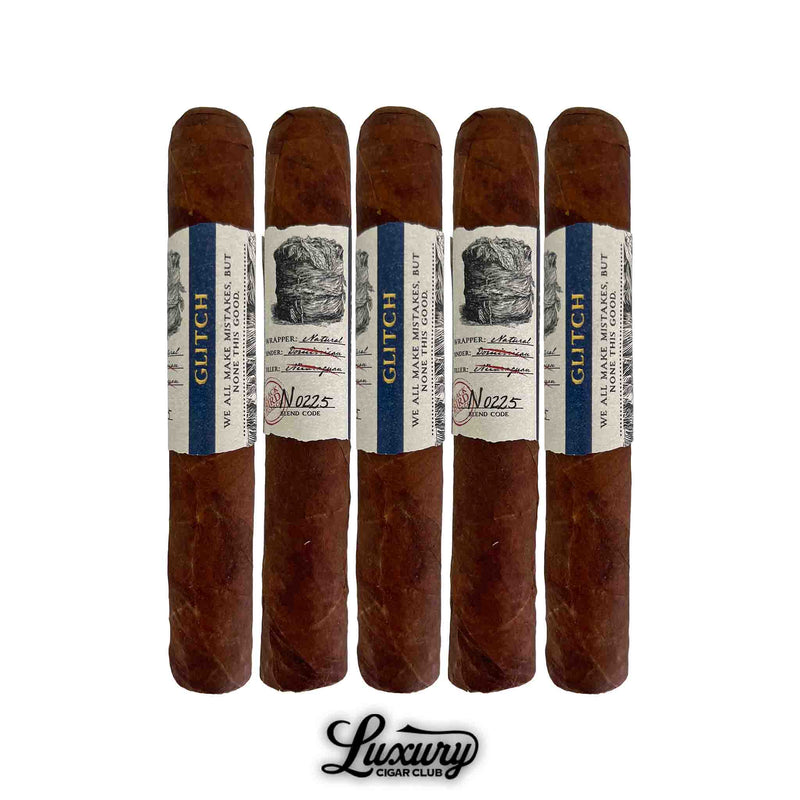Five Blackbird Glitch Natural Robusto cigars lined up in a row, featuring blue and cream labels with batch number details, shown on a white background with the Luxury Cigar Club logo.
