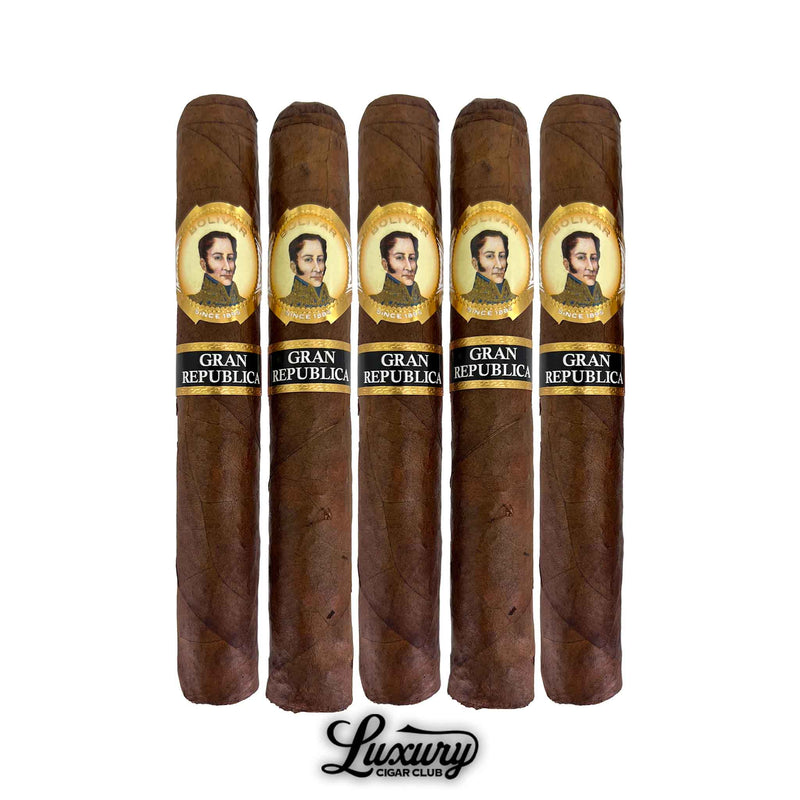 Row of five Bolivar Gran Republica Toro cigars standing upright, showcasing uniform brown wrappers and ornate Bolivar portrait bands, product image by Luxury Cigar Club.