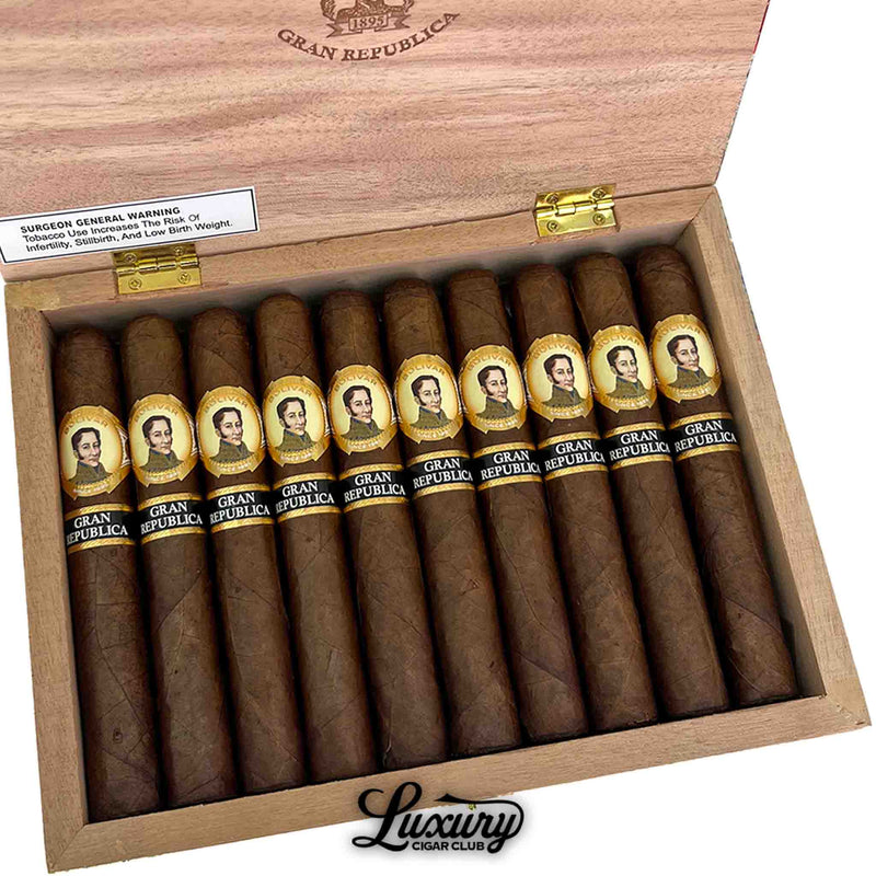 Close-up view of Bolivar Gran Republica Toro cigars inside an open wooden box, highlighting the detailed gold and black bands and rich brown wrappers, presented by Luxury Cigar Club.