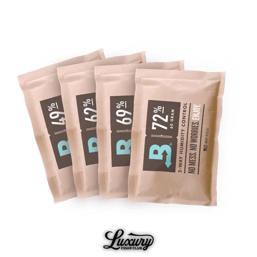 Four Boveda humidification packs, each 60-gram size, labeled with different humidity levels (49%, 62%, 69%, and 72%), designed for two-way humidity control in cigar storage, displayed with the Luxury Cigar Club logo at the bottom.