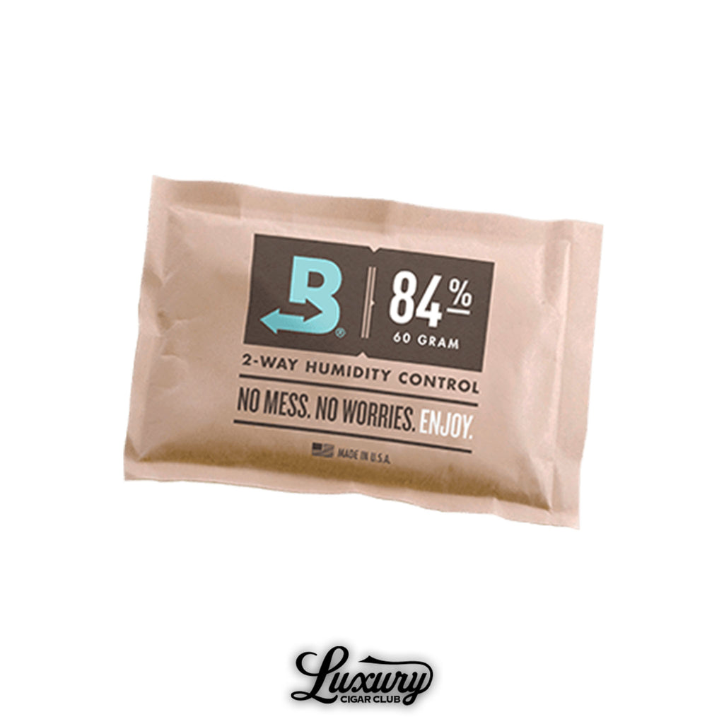 Boveda 84% 60-gram humidor seasoning pack for two-way humidity control, designed to prepare cigar humidors for optimal storage. Available at Luxury Cigar Club.