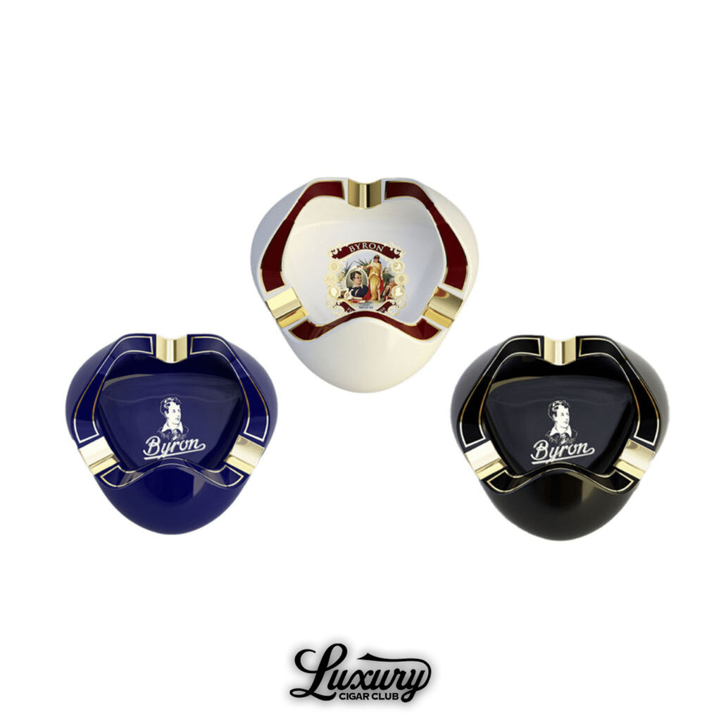 Byron Tulip ashtrays in blue, white, and black finishes with gold accents, featuring the Byron logo and classic portrait design, premium cigar accessories available at Luxury Cigar Club.