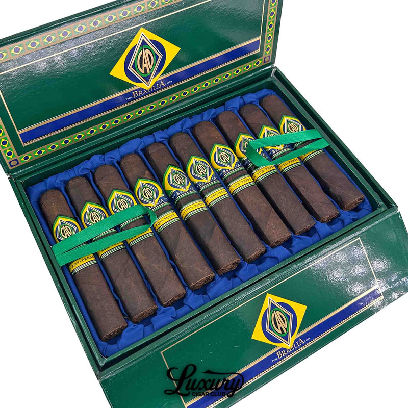Close-up of CAO Brazilia Box-Pressed robusto cigars in a decorative green box, showcasing twelve richly hued cigars with eye-catching CAO Brazilia bands and blue interior lining; from Luxury Cigar Club.