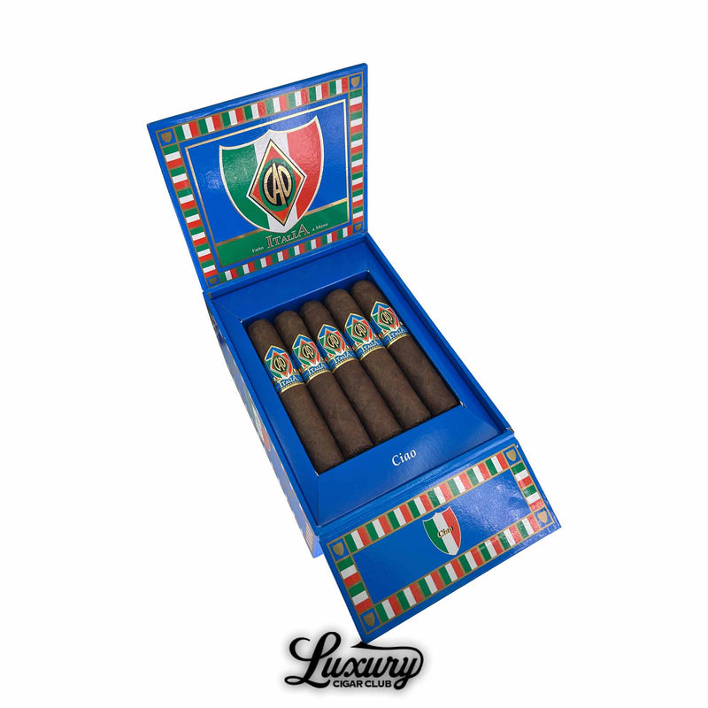 Open box of CAO Italia Ciao robusto cigars with vibrant Italian-themed blue packaging, displaying six dark-wrapped cigars featuring colorful CAO Italia bands; photographed for Luxury Cigar Club product listing.