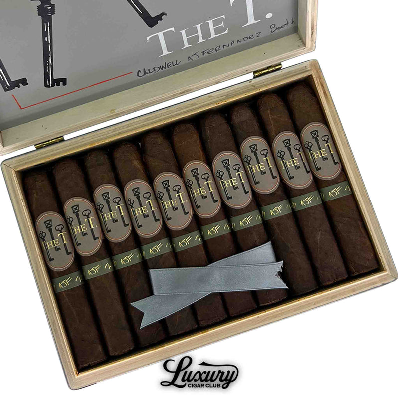 Detailed close-up of Caldwell The T Robusto cigars inside the box, highlighting the elegant wrapper and branding.