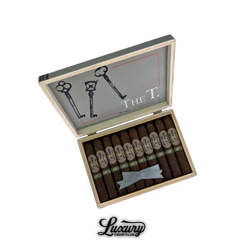 Open box of Caldwell The T Robusto cigars with dark brown wrappers and unique key motif on the cigar bands.