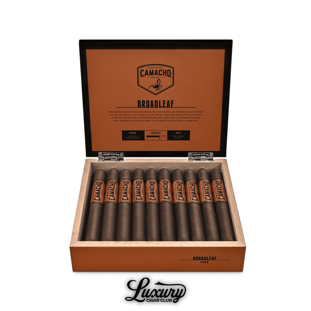 Luxury Cigar Club product photo of Camacho Broadleaf Toro cigars displayed in an open orange Camacho box, showcasing the dark broadleaf wrapped cigars arranged neatly in rows.