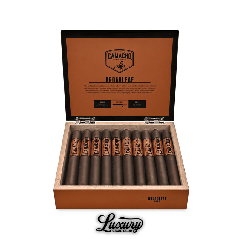 Luxury Cigar Club product photo of Camacho Broadleaf Toro cigars displayed in an open orange Camacho box, showcasing the dark broadleaf wrapped cigars arranged neatly in rows.