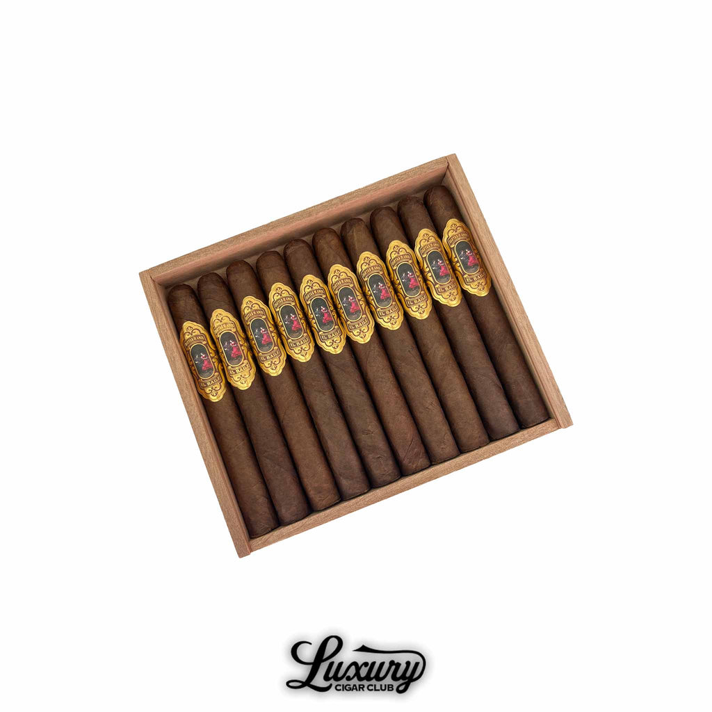 Cartas de Amor El Baile Corona Gorda cigars neatly arranged in a wooden box, featuring elegant gold and black bands with a red floral design, available at Luxury Cigar Club.