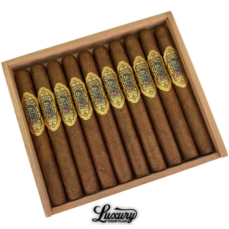 Close-up of Cartas de Amor Mariposas Corona Gorda cigars highlighting detailed gold labels and smooth natural wrappers, presented by Luxury Cigar Club.