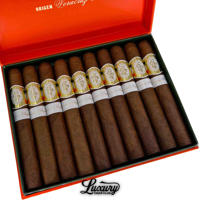 Close-up of Casa 1910 Soldadera Edition Teniente Angela cigars showing rich brown wrappers and ornate gold embossed bands with white secondary labels. Luxury Cigar Club branding below.