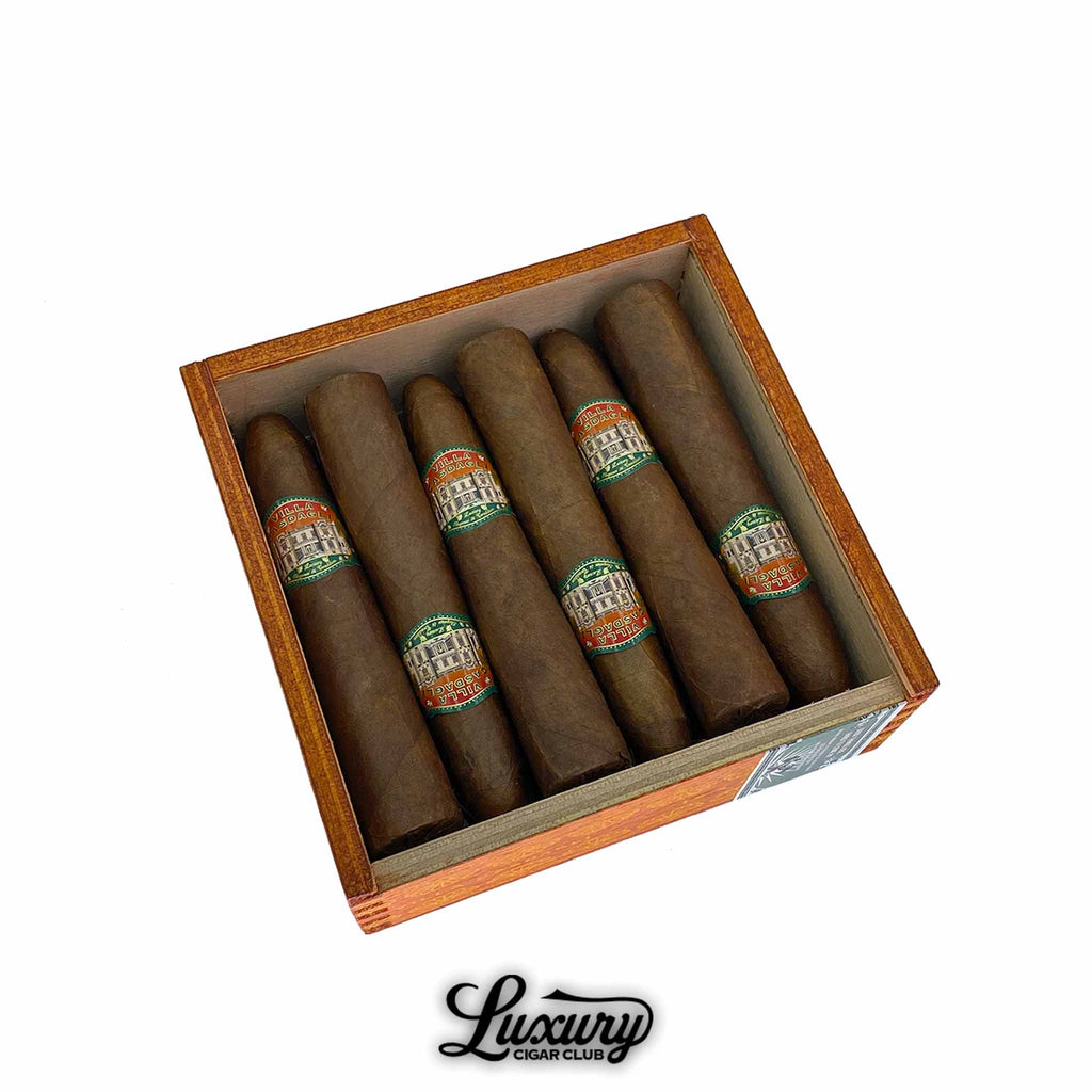 Open box of Casdagli Villa Casdagli Pigasus cigars arranged neatly with decorative cigar bands, presented by Luxury Cigar Club.