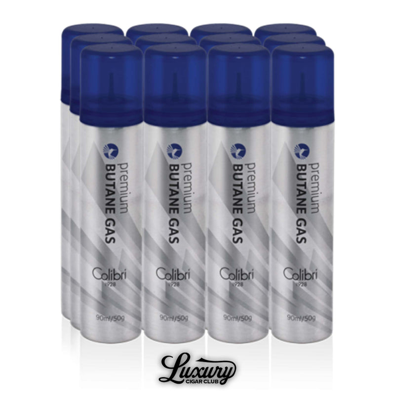 Colibri Premium Butane Gas 3-Pack for cigar lighters, containing 90ml cans of high-purity butane fuel in sleek silver design with blue tops. Luxury Cigar Club branding included at bottom.