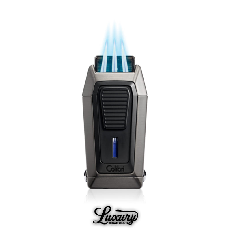 Colibri Quantum V-Cut triple jet flame lighter ignited with triple blue flames in gunmetal finish from Luxury Cigar Club