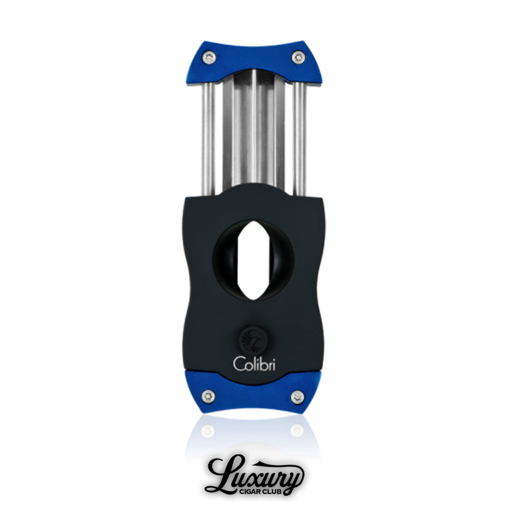 Premium Colibri V-Cut cigar cutter in black with blue accents, sharp stainless steel V-blades extended, designed for precision cigar cutting, displayed on a white background with Luxury Cigar Club logo.