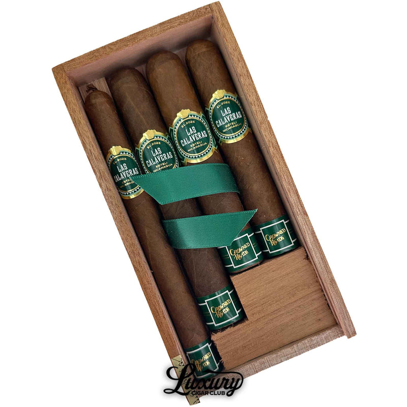 Close-up of Luxury Cigar Club Crowned Heads Las Calaveras 2025 Limited Edition Sampler showcasing Nicaraguan cigars with green and gold bands