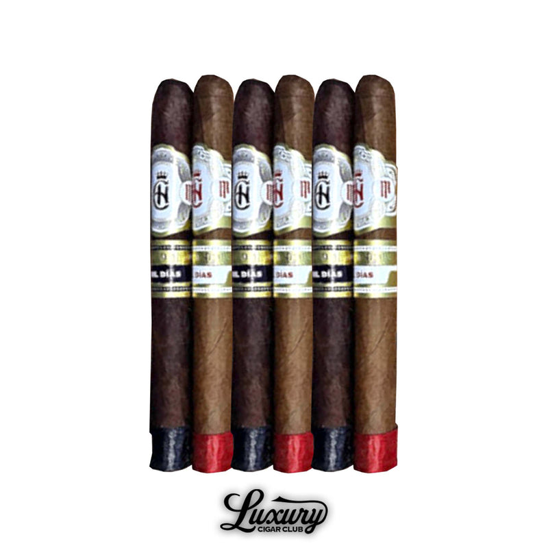 Six Crowned Heads Mil Días Des Duex 2025 Limited Edition cigars with red and black foot bands arranged side by side presented by Luxury Cigar Club