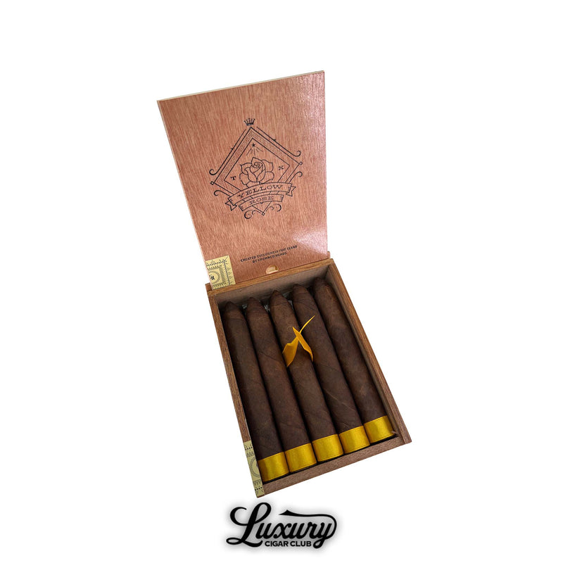 Open wooden box of Crowned Heads Yellow Rose Torpedo cigars showing six dark maduro cigars with gold foot ribbon, pointed torpedo heads, and Yellow Rose branding, premium boutique cigars for sale at Luxury Cigar Club