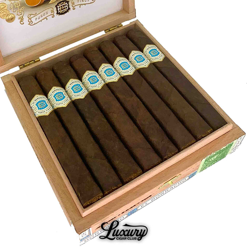 Close up image of Dapper El Borracho Connecticut Broadleaf cigars inside open cedar box at Luxury Cigar Club highlighting the rich dark wrapper leaf and detailed blue and gold cigar bands for online purchase listing