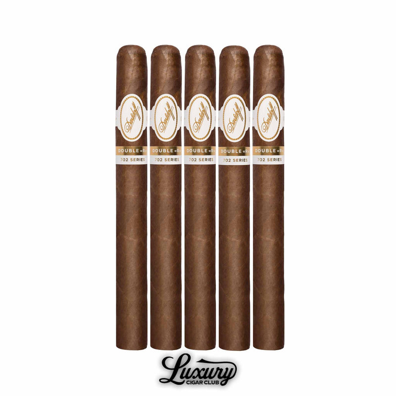 Davidoff 702 Series Aniversario Double R cigars 5 pack, long Churchill-style format with premium Ecuadorian 702 wrapper and refined Davidoff white and gold bands, highlighted with Luxury Cigar Club logo.