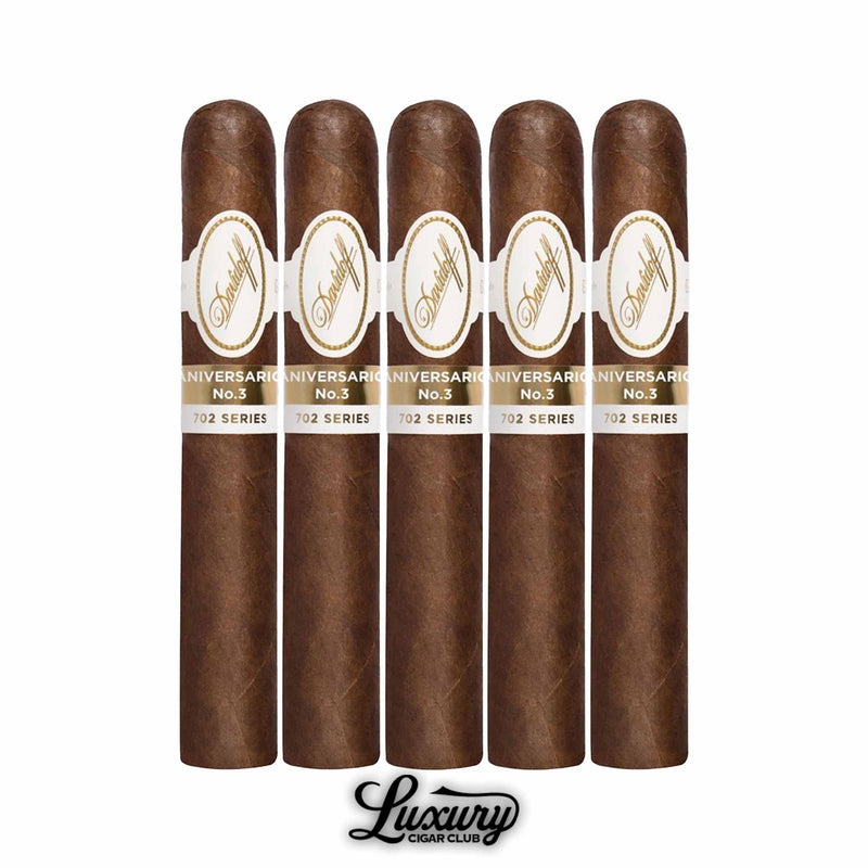 Davidoff 702 Series Aniversario No. 3 cigars 5 pack, showcasing medium-bodied robusto vitolas with signature white and gold Davidoff bands and Ecuadorian wrapper, presented with Luxury Cigar Club branding.