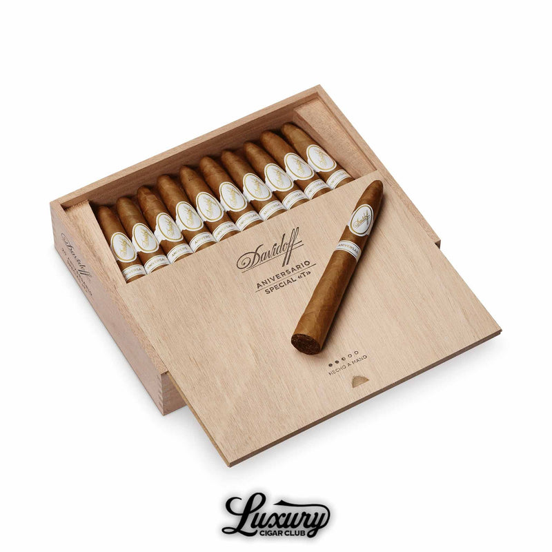 Open box of Davidoff Aniversario Special T cigars with tapered ends, one cigar resting on the wooden lid.