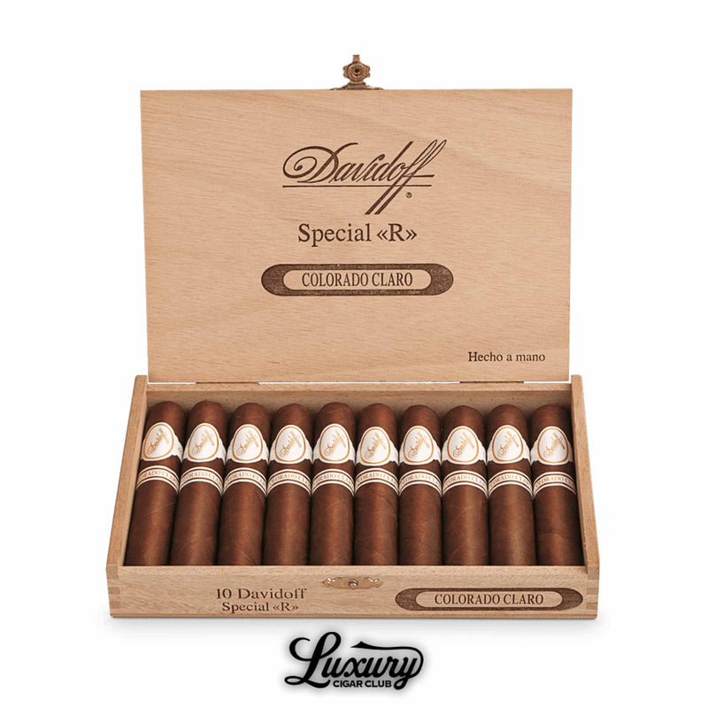 Open Davidoff Colorado Claro Special «R» box containing ten cigars, wooden box interior etched with branding, cigars arranged in two rows, Luxury Cigar Club logo placed beneath.