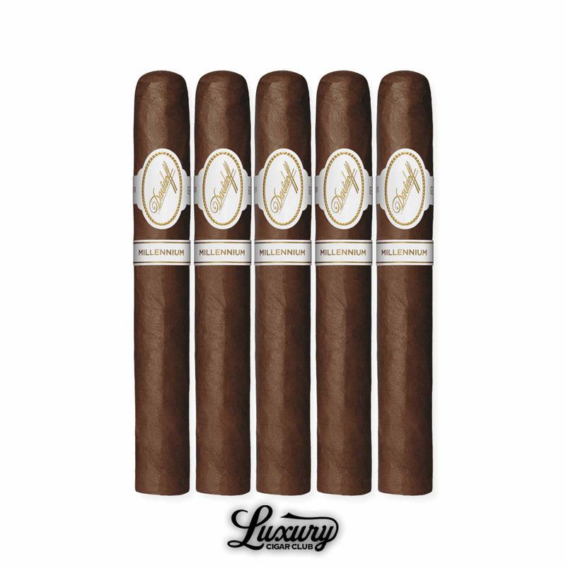 Davidoff Millennium Toro 5-Pack long-format cigars with dark, oily Ecuadorian wrappers, accented by white-and-gold Davidoff Millennium bands, aligned in a row above the Luxury Cigar Club logo.