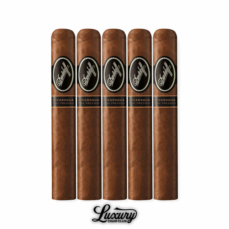 A collection of five Toro Box Pressed cigars from Davidoff Nicaragua, square-pressed design with bold black branding bands, aligned vertically above the Luxury Cigar Club logo.