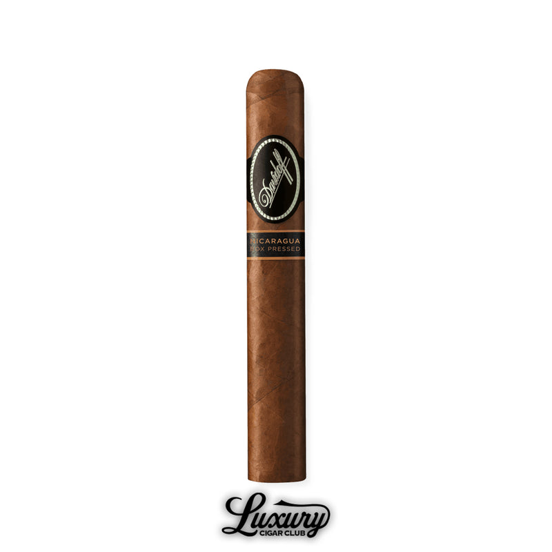 One Toro Box Pressed cigar from Davidoff Nicaragua, dark brown wrapper and box-pressed construction with black Davidoff band, displayed above the Luxury Cigar Club mark.