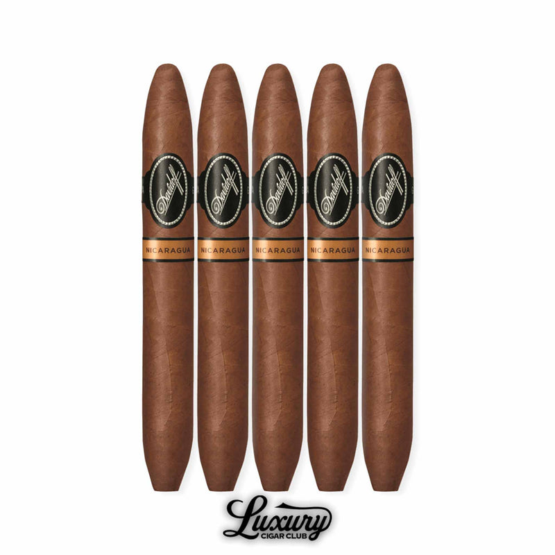A five-pack of Davidoff Nicaragua Diadema cigars featuring a tapered perfecto shape, medium-to-full body profile, and Nicaraguan tobaccos wrapped in a rich Habano wrapper. Each cigar is elegantly banded in black and gold, displayed above the Luxury Cigar Club logo.